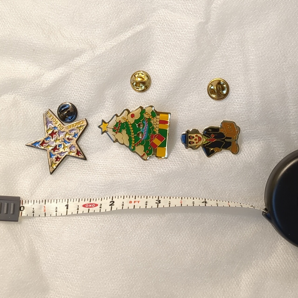 Colorful Cirque du Soleil, clown,  and Christmas Tree Pins